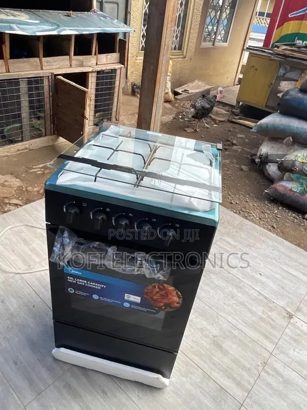Midea 50x50 Gas Cooker With Glass Top Cover · Photo 1