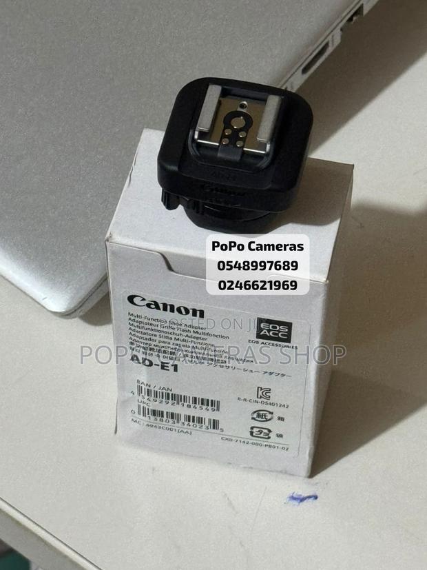 Canon Ad-E1 ( Speedlight Converter for Canon R50) · Photo 1