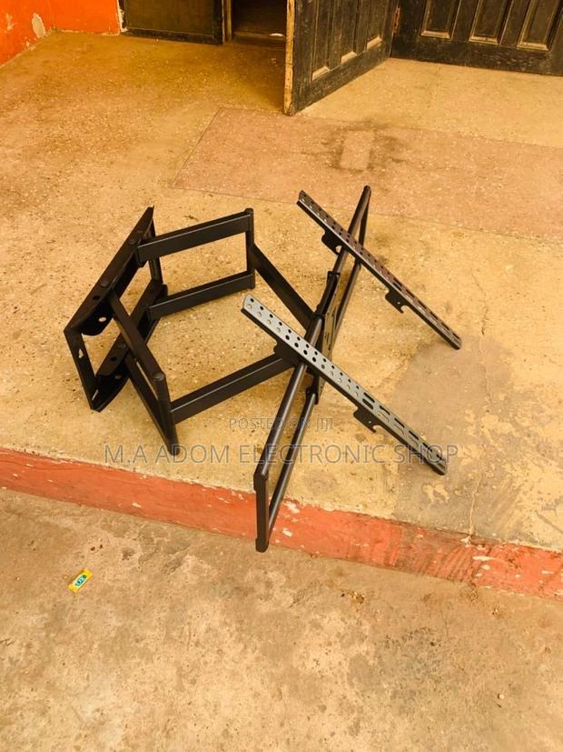 Space-Saving Viewing Solution:Adjustable 32”-70” TV Mount · Photo 1