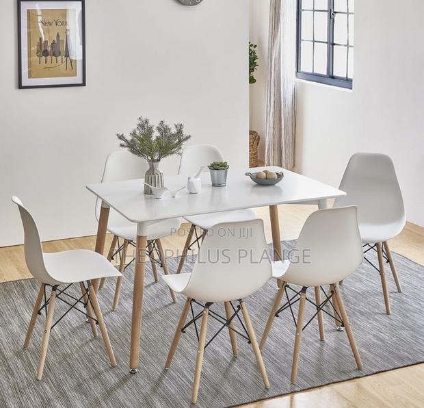 White Dining Table Set With 6 Nordic Chairs · Photo 1