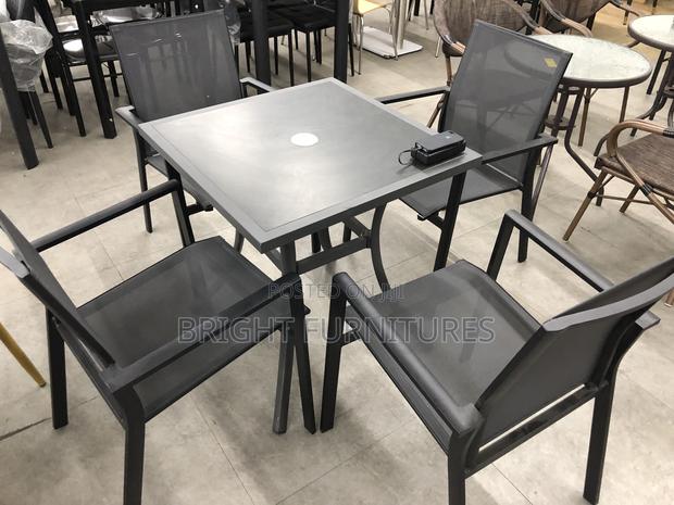 Foreign Quality Outdoor Table With Four Chairs · Photo 1