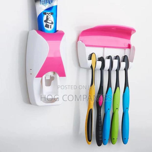 Automatic Toothpaste Dispenser and Toothbrush Holder Set · Photo 1
