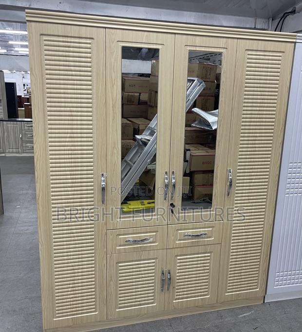 Modern Foreign 4 Doors Wardrobe With Drawers and Mirror · Photo 1