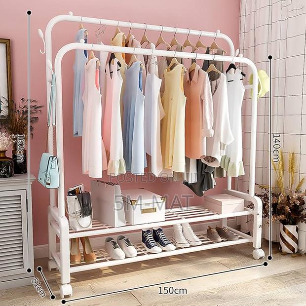 STARMS Clothes Rack on Wheels, Metal Heavy Duty Garment Rack · Photo 1