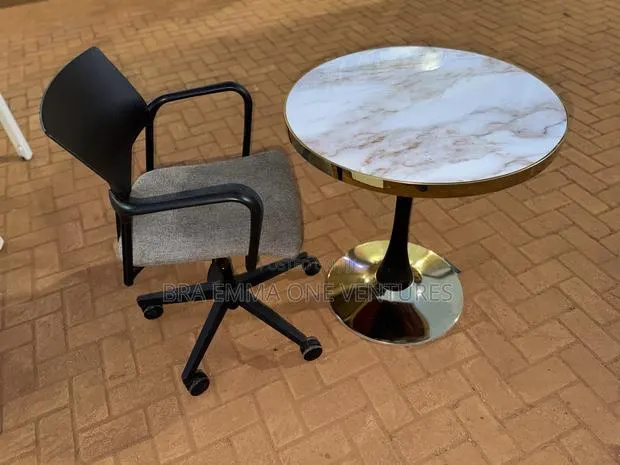 Modern Round Table With Comfortable Swivel Chair · Photo 1