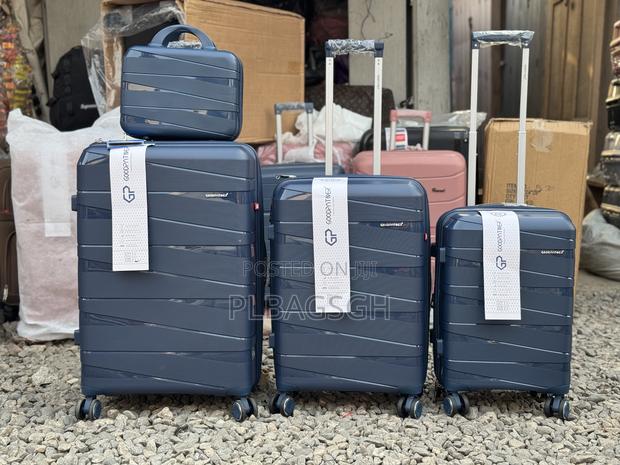 Four PCS 20/24/28 Inches and a Cosmetic Trolley Luggage · Photo 1