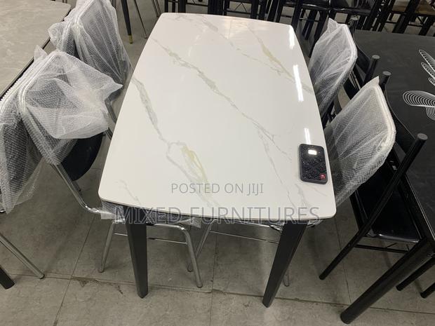 Marble Dining Table With Chairs for Living Rooms · Photo 1