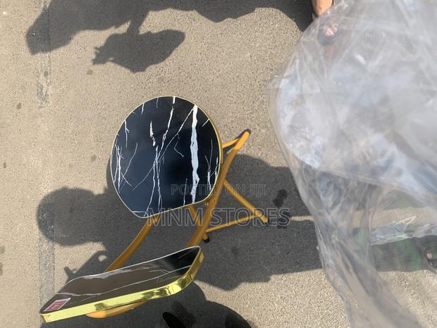 Foldable Black and Gold Foldable Chair · Photo 1
