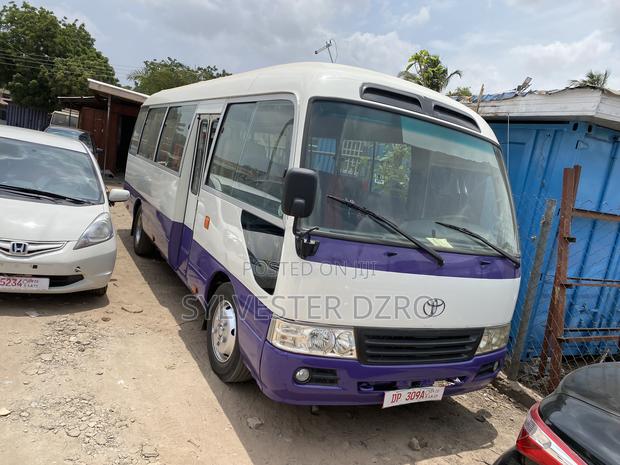 Toyota Coaster 2009 White · Photo 1