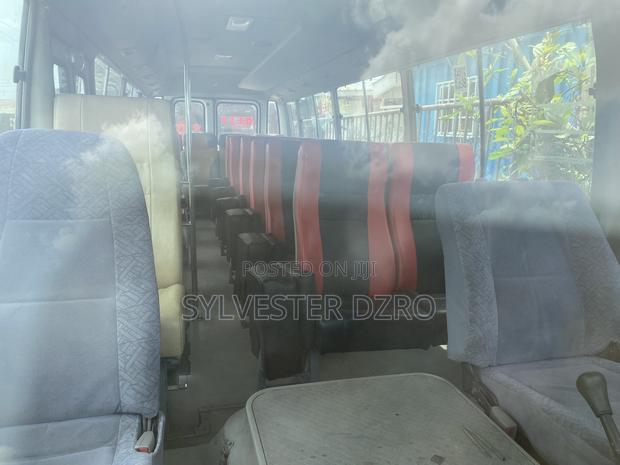 Toyota Coaster 2009 White · Photo 2