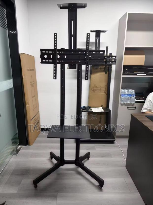 Up to 70 Inch Movable Tv Stand · Photo 1