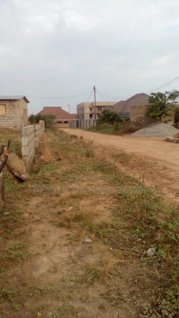 Half Plot of Land With Wall at Amasaman Danchira · Photo 1