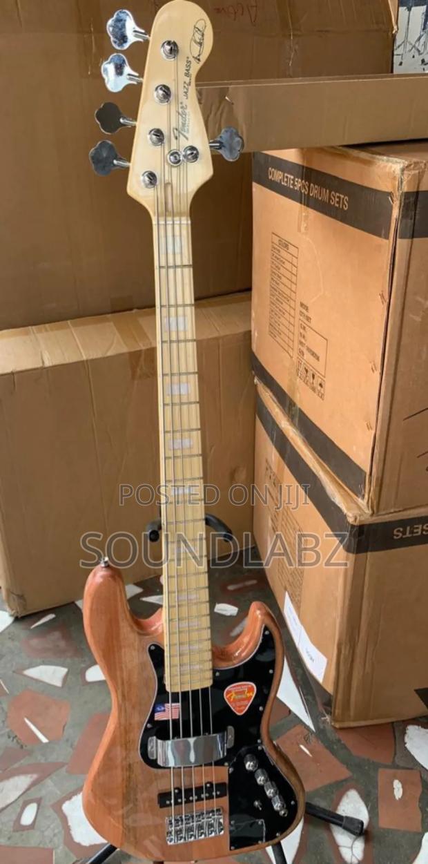 Brown Coloured Active Fender Bass Guitar · Photo 1