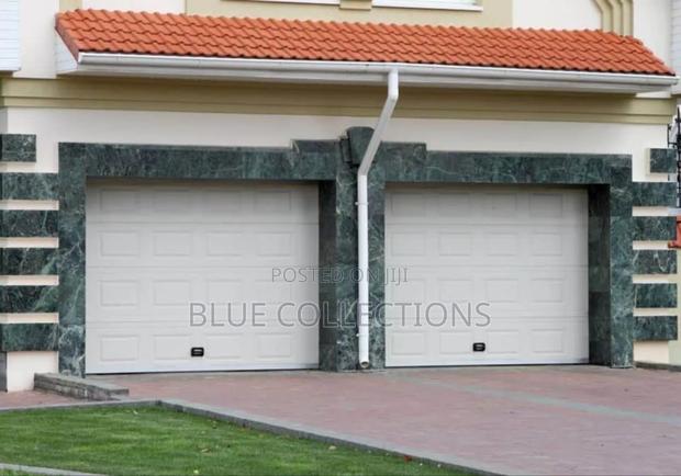 Double Panels Garage Doors · Photo 1