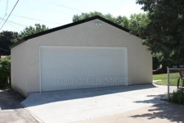 Double Panel Garage Doors · Photo 1