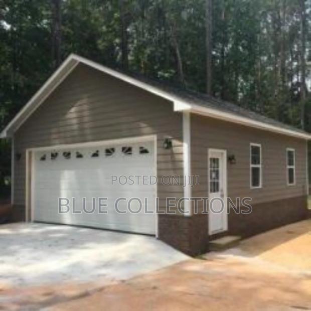 Smart Home Garage Door With Arch Fanlight · Photo 1