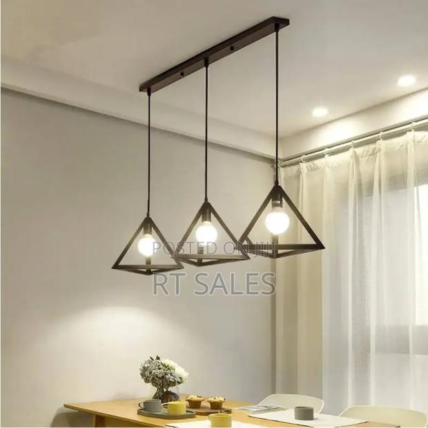 Long and Short Base Triangle Pendant Light. · Photo 1