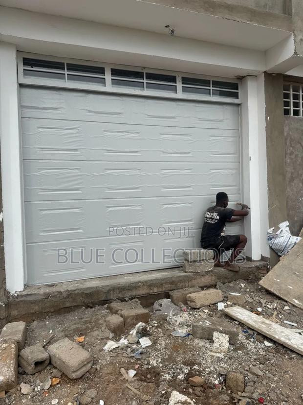 Automated Garage Door With Fanlight · Photo 2