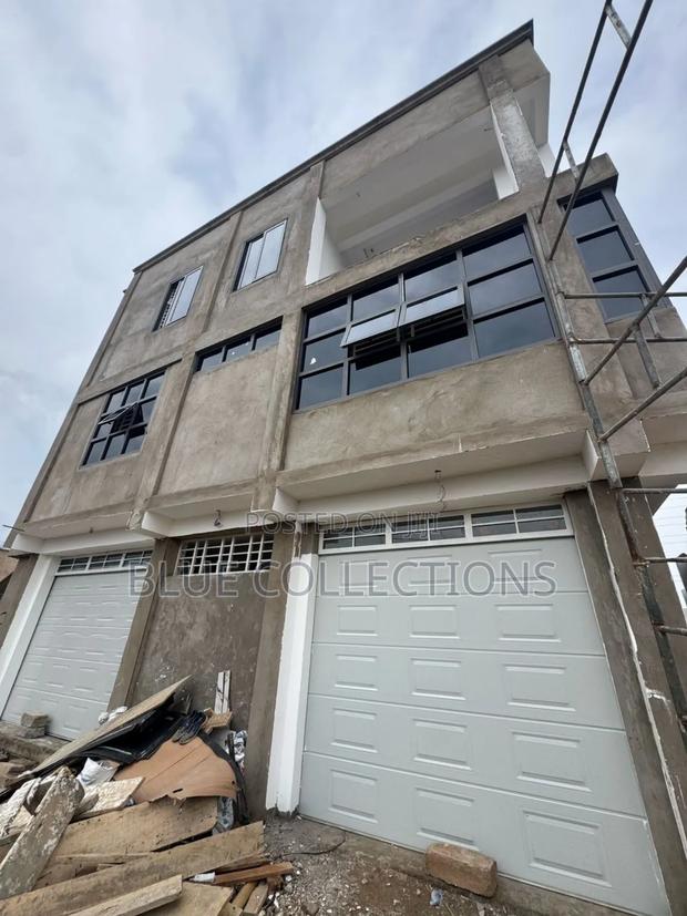 Garage Door With Fanlight and Remote · Photo 1