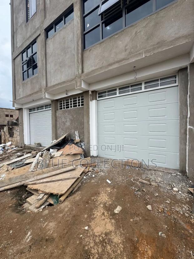 Garage Door With Fanlight and Remote · Photo 2