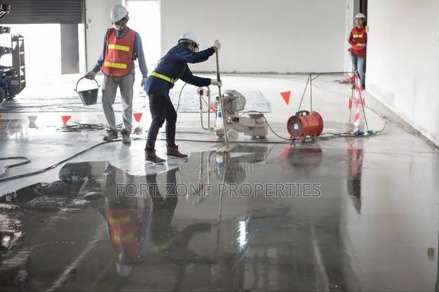 Ghana Man Cleaning With Cleantex · Photo 1