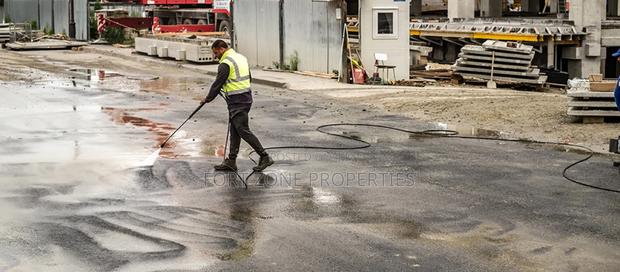 Ghana Man Cleaning With Cleantex · Photo 2