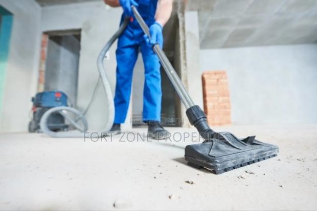Ghana Man Cleaning With Cleantex · Photo 3