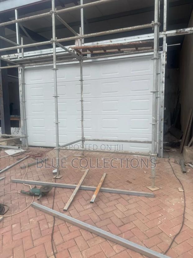 Stylish Automated Garage Door · Photo 1