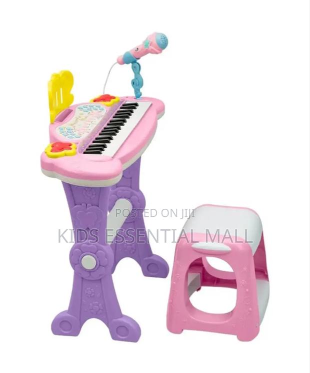 Keyboard or Piano With Stand and Chair · Photo 1