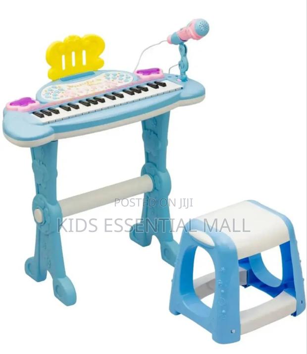 Keyboard or Piano With Stand and Chair · Photo 2