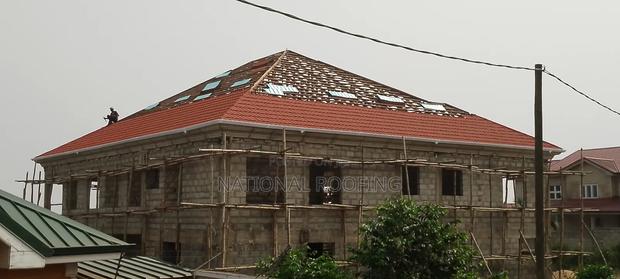 Installation of Rain Gutter and Stone Coated Roofing Sheet. · Photo 2