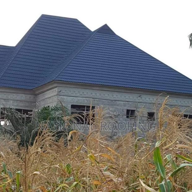 Installation of Stone Coated Roofing Material. · Photo 1