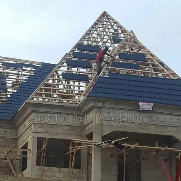 Installation of Stone Coated Roofing Material. · Photo 2