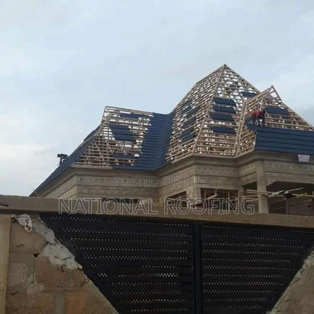 Installation of Stone Coated Roofing Material. · Photo 3