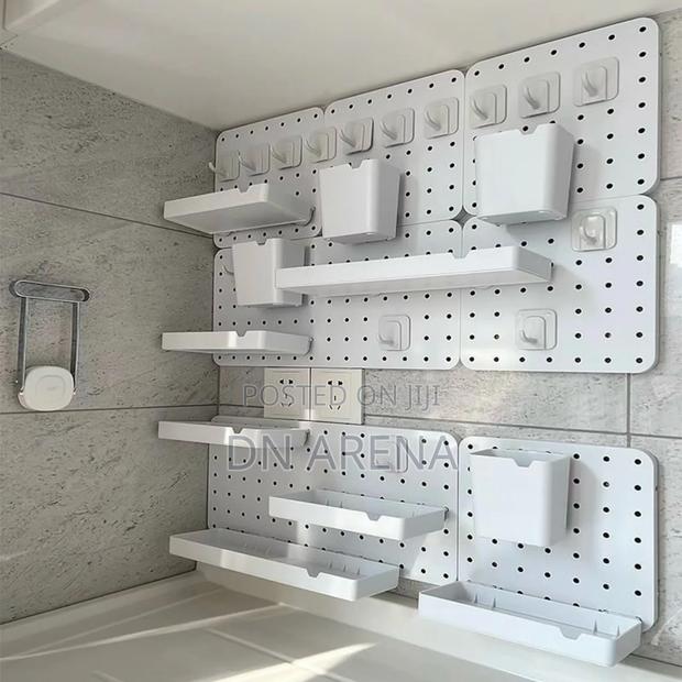 White and Black Plastic Peg Board Perforated Board · Photo 1