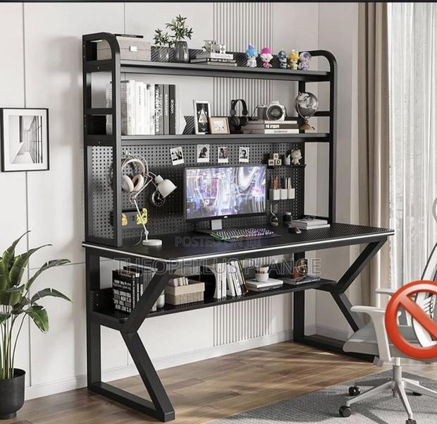 Double Decker Study Table With 2 Shelves and Pegboard. · Photo 1