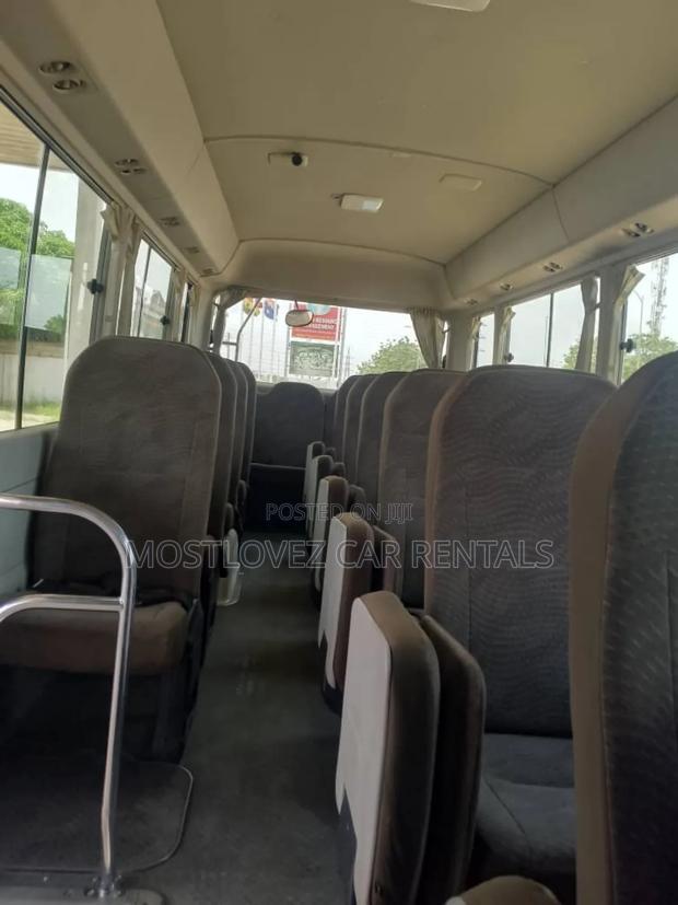 Car Rentals Rent a Toyota Coaster Buses for Your Travels · Photo 2