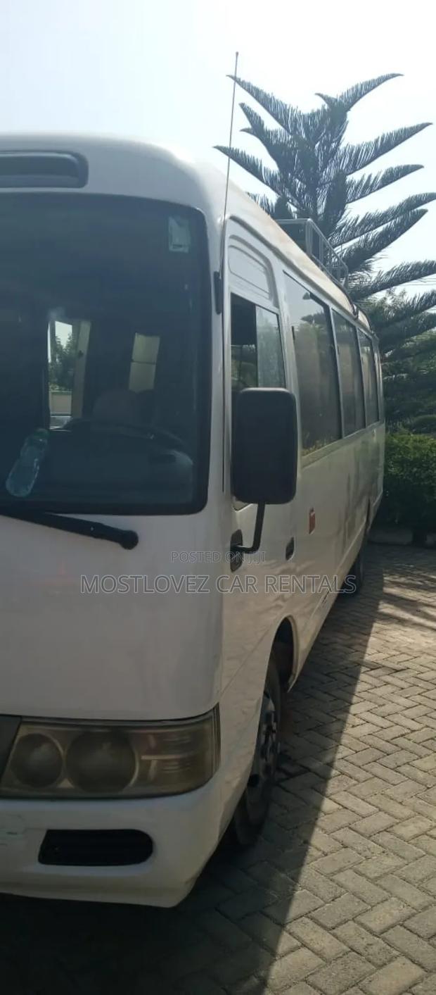 Car Rentals Rent a Toyota Coaster Buses for Your Travels · Photo 3