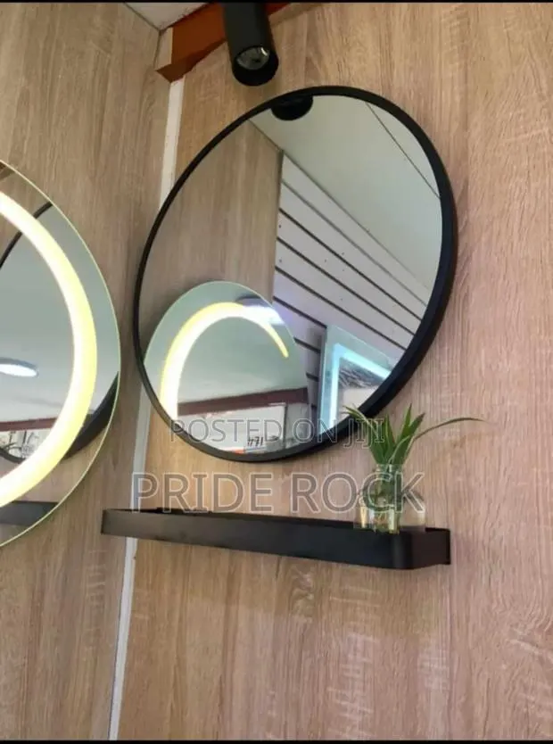 Black Round Mirror With Metal Shelf · Photo 1