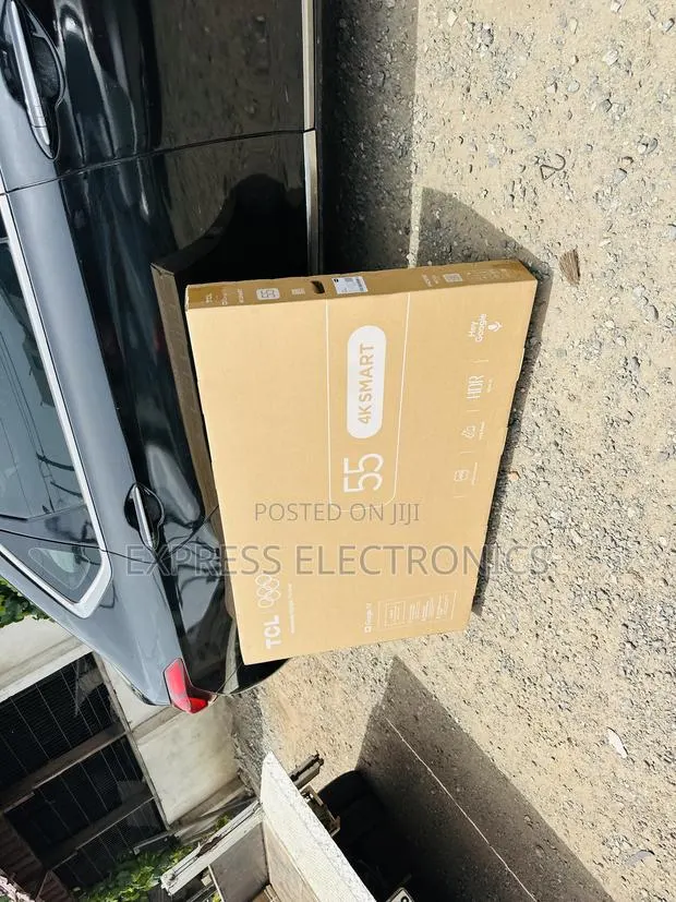 Shop the New TCL 55”UHD Smart Glossy TV · Photo 1