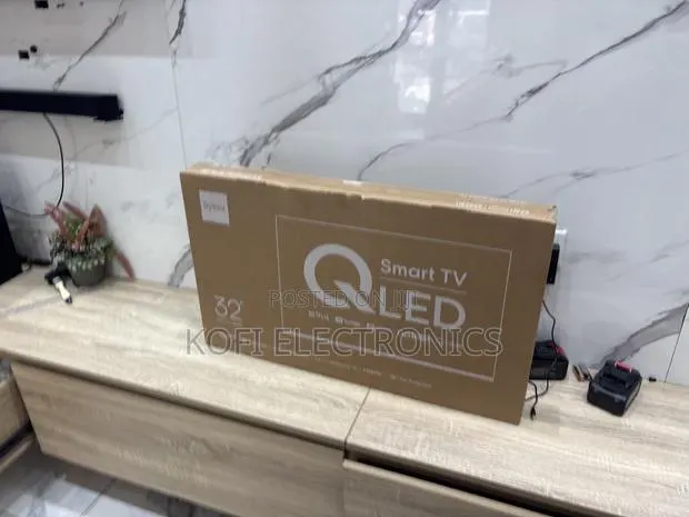 A Built in Extras Syinix 32-Inch QLED Smart TV · Photo 1