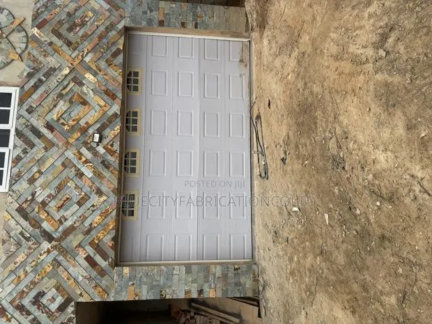 American Automated Garage Door With Automatic Motor Remote · Photo 1