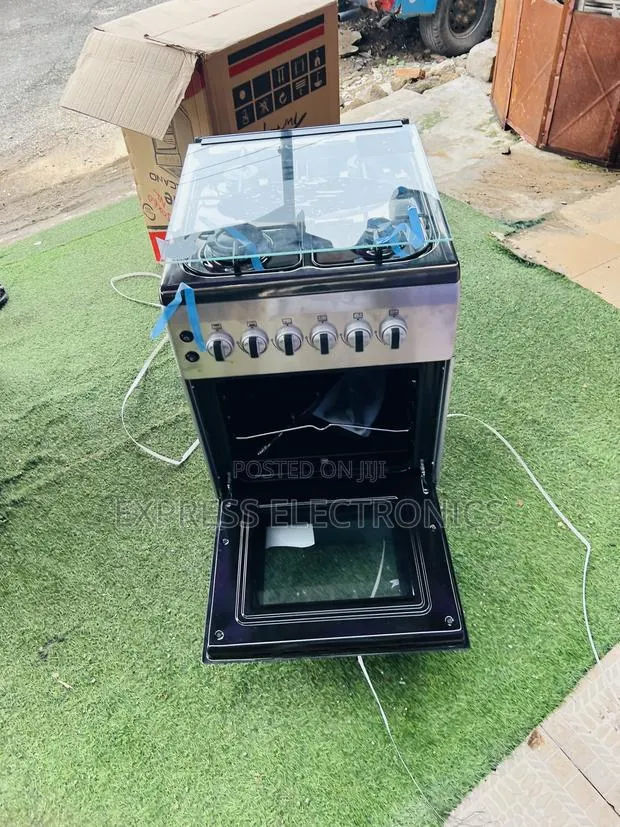 Available Now New Line Gas Cooker Oven 4burner 50/60 · Photo 1