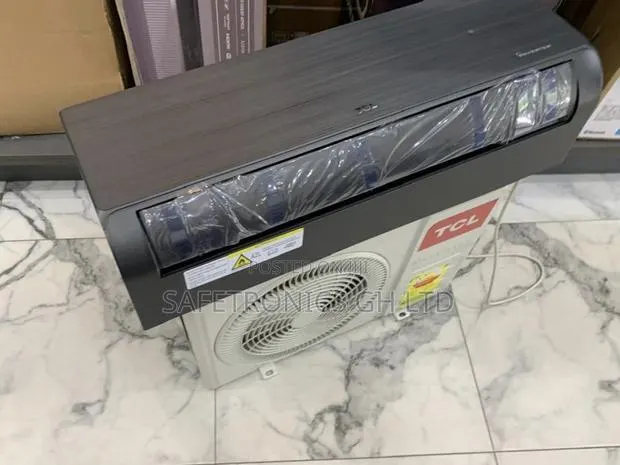 Get Accurate TCL 1.5 Hp Dark Black Inverter Air Conditioner in Dark · Photo 1