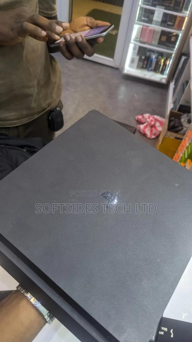Nice Playstation 4 Slim Machine With 8 Games at Cool Price · Photo 2