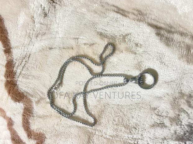Fist With Ring Long Necklace · Photo 2