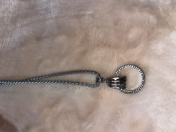 Fist With Ring Long Necklace · Photo 3