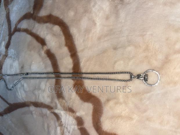 Fist With Ring Long Necklace · Photo 1