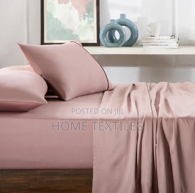 2 Pink Bedsheets and 4 Pillow Cases · Photo 1