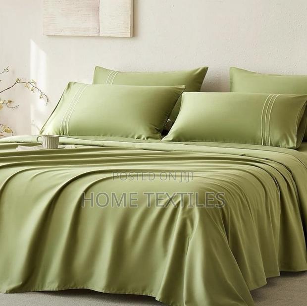 2 Green Bedsheet (Fitted and Flat Sheets) and 4 Pillow Cases · Photo 1